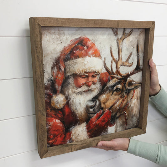 PRE ORDER- “Santa Embracing Reindeer” Canvas Wooden Framed Art